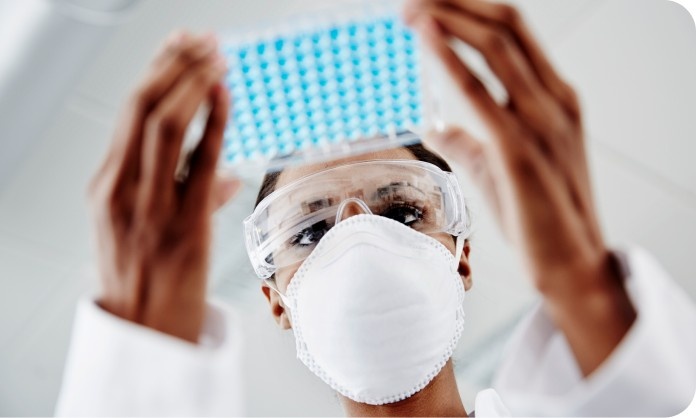 Pathologist Reviewing Lab Sample for PTEN Testing
Image Pathologist Reviewing Lab Sample for PTEN Testing Image